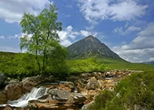 Mountain scenery - Buachaille Etive Mor and Coupal river at low water level with red rocks and boulders visible