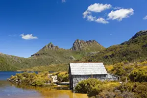 Mountain scenery - stunning Dove Lake in front of massive Cradle Mountain is one of Tasmania's most beautiful and famous natural features. A rustic boat shed gives a romantic touch - Cradle Mountain-Lake St