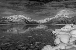 Images Dated 15th July 2021: Mountains reflect in wintry Lake McDonald in Glacier National Park, Montana, USA Date: 17-02-2021