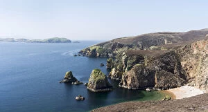 Muckle Roe (big red isle) is famous for the red, pristine granite cliffs and beaches, Shetland islands, Scotland