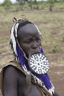 Mursi people - man with lip plate / plug / disk