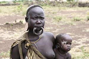 Mursi people - woman without her lip plate / plug