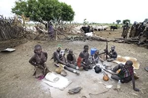 Images Dated 17th August 2005: Mursi Tribe - village with woman working