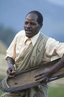 Images Dated 13th August 2008: Musician at cultural village near Kinigi at border