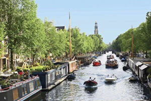 Images Dated 15th August 2012: Netherlands, Amsterdam, Boats cruise along