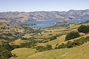 New Zealand - Scenic of Akaroa harbour surrounded by volcanic hills New Zealand - Scenic of Akaroa harbour surrounded by volcanic hills