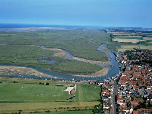 NORFOLK - Aerial of Wells-next-the-Sea. Salt marsh landscape and coastline at low tide