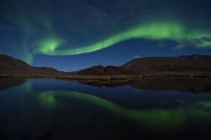 Borealis Gallery: Northern Lights reflected in lake at night Yukon, Canada