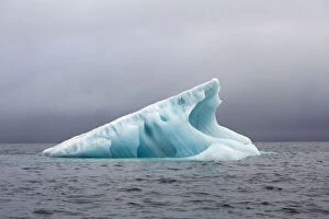 Norway, Spitsbergen. Blue glacial iceberg