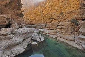 Barren Gallery: Oman, Wadi Shab, natural pool a with gravels