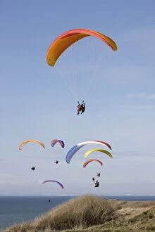 Paragliders - in flight by North Sea