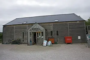 Photovoltaic shingle tile roof - on Brockweir & Hewelsfield Village Shop Forest of Dean UK. Almost the entire roof is photovolatic shingles with just a small strip of ordinary tiles on each side
