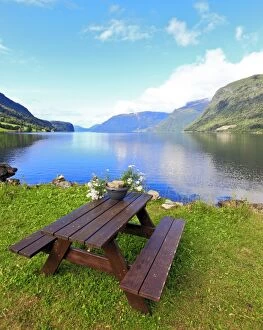 Picnic Table by lake and mountains
