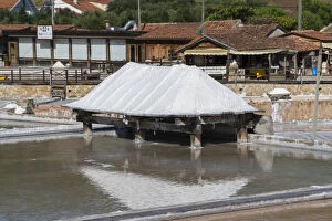 Evaporation Gallery: Piles of salt drying on wooden decks at Rio Maior