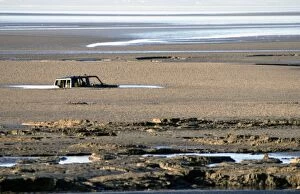 PM-10180 Morecombe Bay quicksands and tide engulf a Four wheel drive vehicle