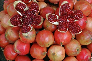 Crops Collection: Pomegranate: opened to show seeds within sweet jelly. Widely cultivated as food