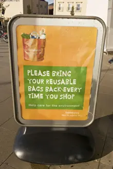Recycling Prints: Poster encouraging reusable bags outside Sainsbury's Cheltenham UK