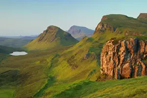 Skye Prints: The Quiraing landscape lake and rolling velvet green slopes sprinkled with basaltic spikes of rock