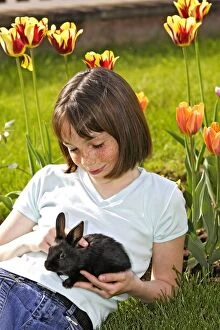Images Dated 5th May 2006: Rabbit - being held by girl