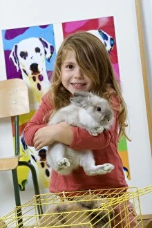 Images Dated 7th November 2006: Rabbit - being held by young girl