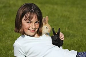 Images Dated 5th May 2006: Rabbits - being held by girl