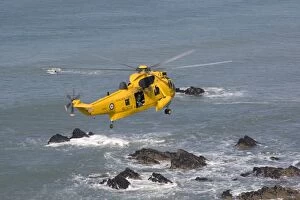 Images Dated 20th September 2008: RAF helicopter air sea rescue - hovering over rocks