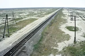 Turkmenistan Prints: Railway Ashgabad - Krasnovodsk - in desert landscape along the Kopet-Dag mountains - a major transport artery