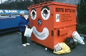Bottle Gallery: Recycling - woman recycling plastic bottles in