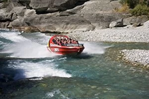 Images Dated 27th February 2007: Red Shotover jet boat skimming through Shotover