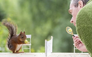 Ball Gallery: Red Squirrel and man standing on a tennis court Date: 16-06-2018