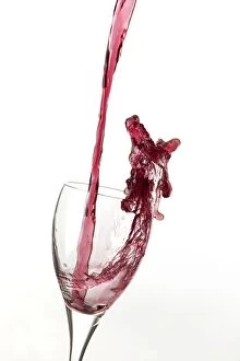 Alcoholic Gallery: Red wine being poured a into glass