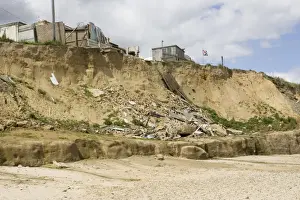 Remains of collapsed houses after severe coastal erosion Happisburgh North Norfolk Coast UK