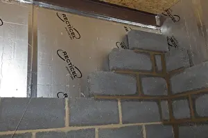 Warmth Prints: Reticel Sheet Insulation - in cavity of new cement block walling - UK