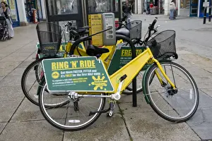 Drive Prints: Ring N Ride OYB yellow bike rental docking station Cheltenham High Street Gloucestershire UK