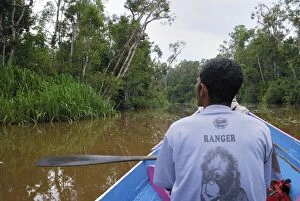 Images Dated 8th November 2007: River with boat and guide at Tanjung Puting national park