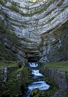 River - The source of the River Loue, where it emerges from a huge cave at the base of a jurassic limestone cliff