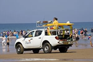 RNLI Beach Lifeguards Rescue vehicle on crowded