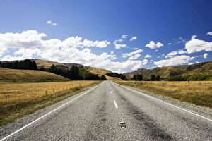 Tarmac Collection: Road - long straight deserted tarmac paved road, rolling hills, white clouds, blue sky