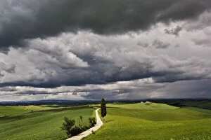 Road and storm clouds, rural Tuscany region