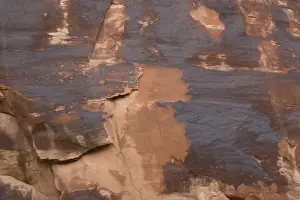 Geological Prints: Rock varnish, formed on sandstone cliffs over long period by bacterial action