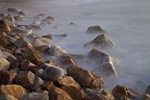 Waves Gallery: Rocks and waves on Llandudno Beach at sunset