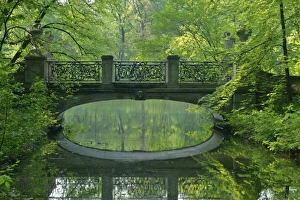 Images Dated 29th April 2007: Romantic bridge in baroque style reflecting in brook in spring forest Park of Nymphenburg castle
