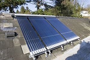 Images Dated 4th April 2007: Roof mounted Vaillant aurotherm evacuated tube solar collectors installed on slate roof Cotswolds UK