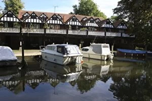 Berkshire Gallery: Row of Boathouses with balcony and with boats moored