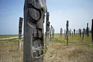 Images Dated 10th June 2010: Saemangeum Korea - Jangseung Totem Poles carved faces with contorted scream opposition to the land