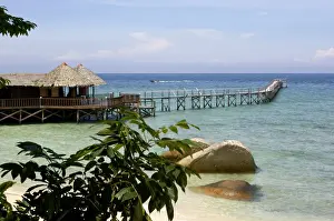 Jetty Prints: Sand beach, a bar and a jetty of the small Bagus Place Retreat resort on Tioman Island