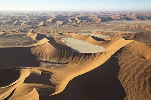 Sand dunes and dry pans in the Namib Desert - in