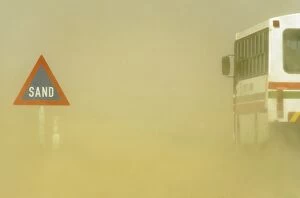 Sand Road Sign and sandstorm at the B 2 tarred road