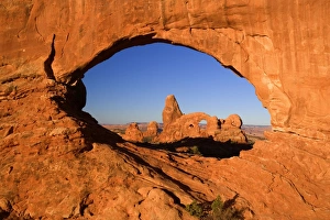 Sandstone arches - Turret Arch seen through the North Window at early morning Sandstone arches - Turret Arch seen through the North Window at early morning