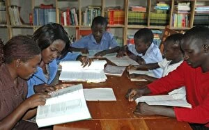 Images Dated 14th January 2006: School children reading books, Uganda, Africa